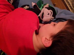 sleeping child and sesame street count von count doll