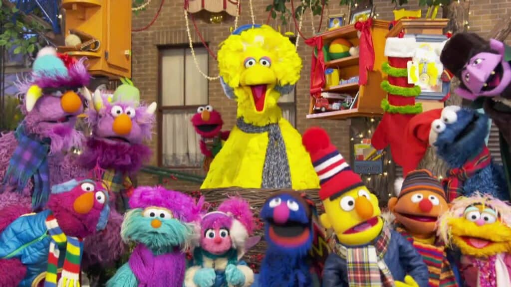 Sesame Street characters including Elmo, Big Bird, Cookie Monster, Abby Cadabby, Ernie, Bert, and others together